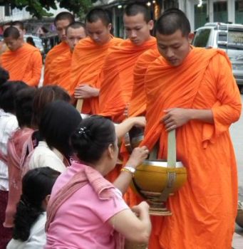 These ladies believe they can earn good karma by giving food each day to Buddhist monks. 